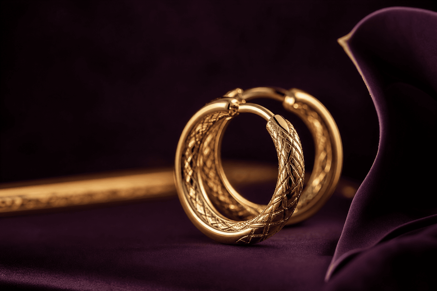 Celestia jewelry catching soft light against a dark plum backdrop