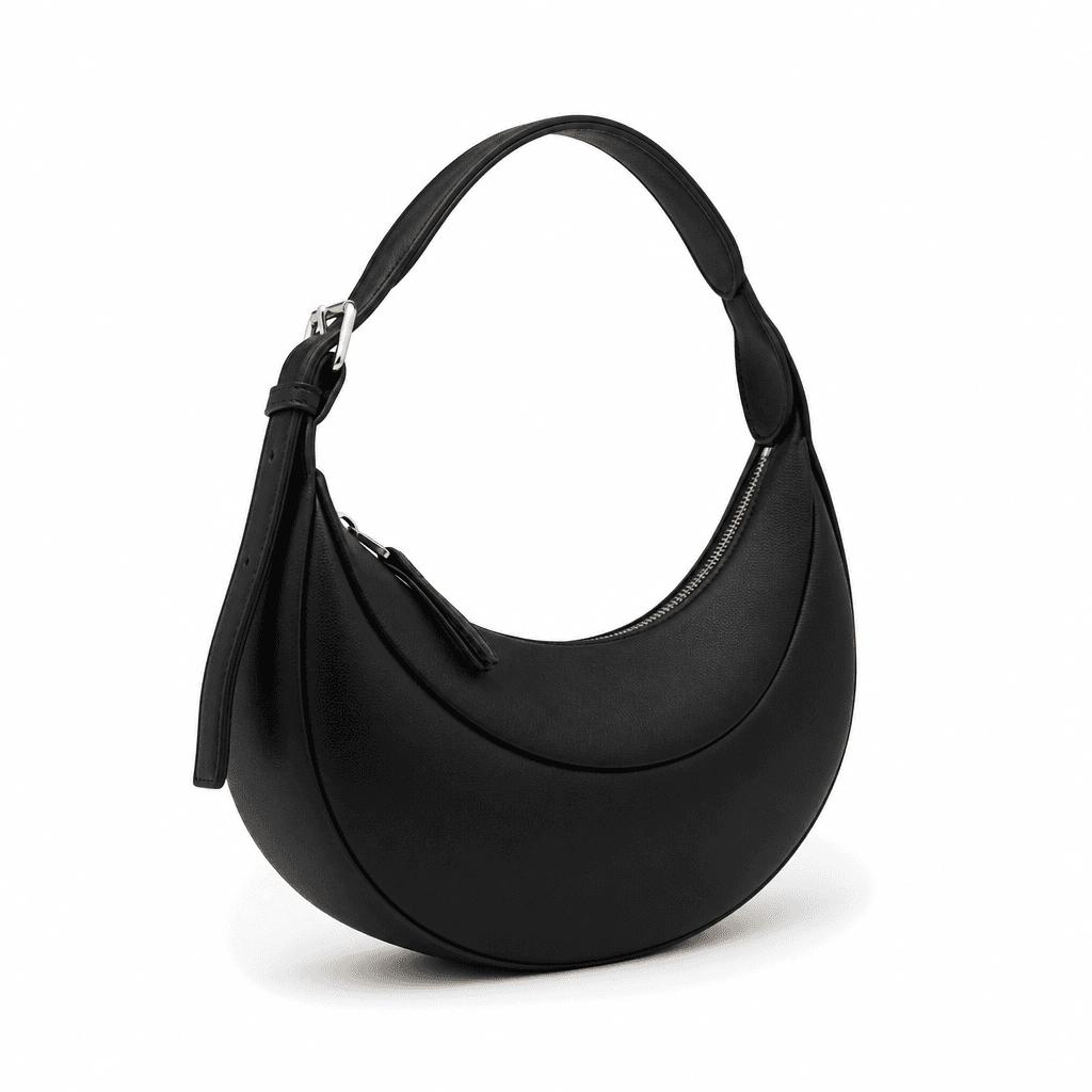 Astra Crescent Shoulder Bag in Black, front three-quarter view on white background